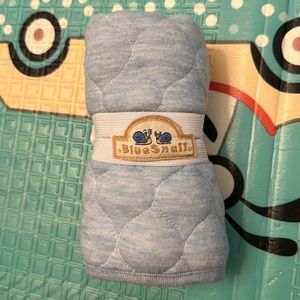 Blue snail changing pad.